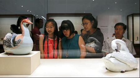 Visitors ire two tureens in the form of geese made in Jingdezhen, Jiangxi province, China, in Qing Dynasty, at the exhibition ion for Porcelain, Masterpieces of Ceramics from the British Museum and the Victoria and Albert Museum, which opens in the National Museum of China in Beijing on Jun. 22, 2012. A total of 148 exquisite pieces (sets) of porcelain from the British Museum, and the Victoria and Albert Museum are on display, including export porcelain ware of the early Ming Dynasty, those made to Western orders in China, porcelain inspired by Chinese ceramics made in Europe in the mid Qing Dynasty, and exquisite porcelain ware produced by China's official kilns collected at the two Museums. The exhibition sheds light on the ancient Chinese history of exporting porcelain products, the porcelain ware, unique designs, and the influences thus exerted upon the porcelain-making industry and social customs of the West. 22JUN12 Photo by Simon Song (Photo by Simon Song/South China Morning Post via Getty Images)