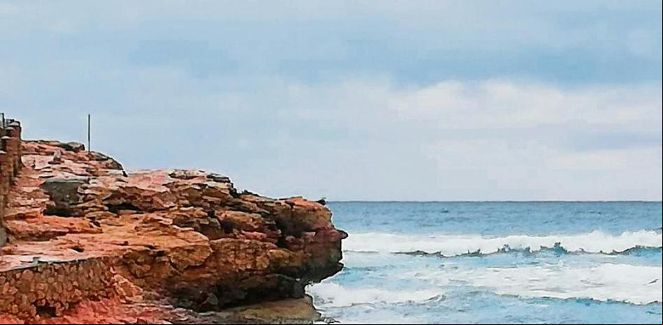 La cara en la roca de la playa de la Arrabassada