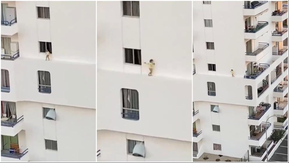 Escalofriante paseo de una niña por la cornisa de un hotel